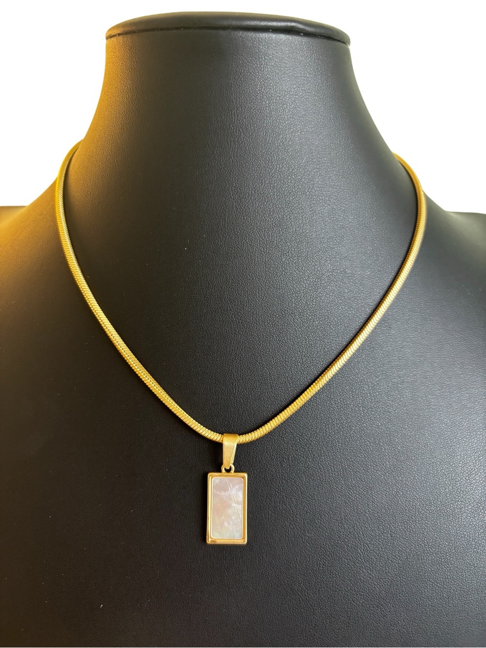 Rectangular Mother of Pearl Pendant on Gold Tone Snake Chain.